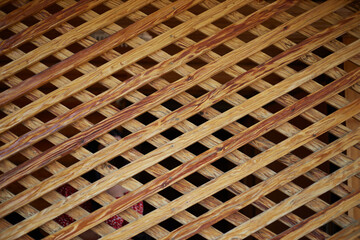 Photo of the wooden lattice of the veranda window wooden pattern grid diamond. Texture or background for the design