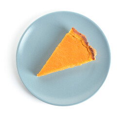 Plate with piece of delicious pumpkin pie on white background