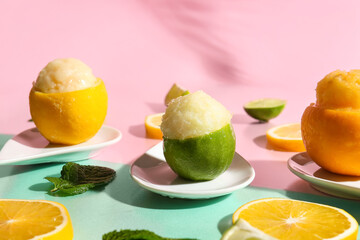 Plate with tasty ice creams in citrus fruit peels on color background