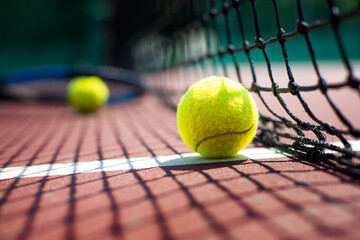 Tennis ball lying on the court. Healthy lifestyle concept