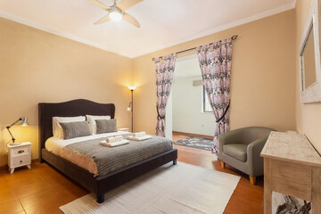 Bedroom in classic traditional Mediterranean style with double bed.