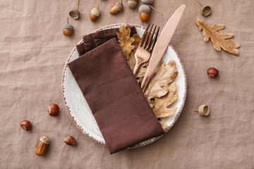 Stylish autumn table setting on color fabric background