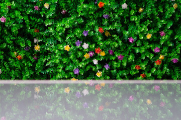 Colorful daisies in meadow. Artificial green grass field for decorated on wall or floor.