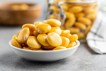 Pickled yellow Lupin Beans in bowl - obrazy, fototapety, plakaty