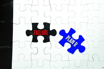 Fototapeta premium puzzle with the word Failure and replaced with plan B. the concept of success
