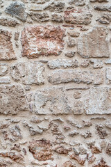 Old stone background. Ancient weathered stone wall texture.