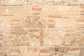 Old bricks background. Ancient weathered stone wall texture.