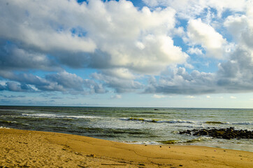 Fototapeta na wymiar Beach with clouds on blue sky at sunset