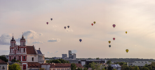 Vilnius city centre panorama with the hot air baloons in the background