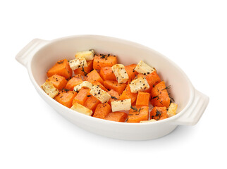 Dish with tasty baked pumpkin pieces on white background