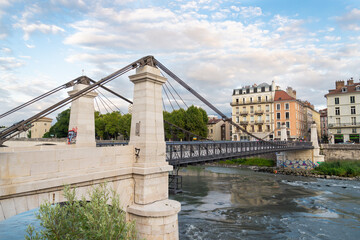 The bridge crossing the river named "Isère" and leading to the historical centre of Grenoble, European Alps, France.