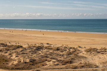 People walking in beach in Spain