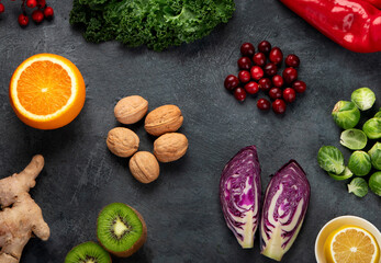 Obraz na płótnie Canvas Foods high in vitamin C on dark background.
