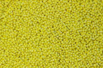 yellow granules of polypropylene or polyamide. background. Plastics and polymers industry. Copy space.