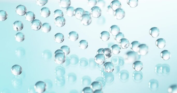 Super slow motion of falling blue hydrogel balls. Cosmetic, youth and beauty concept. Filmed on high speed cinema camera, 1000fps