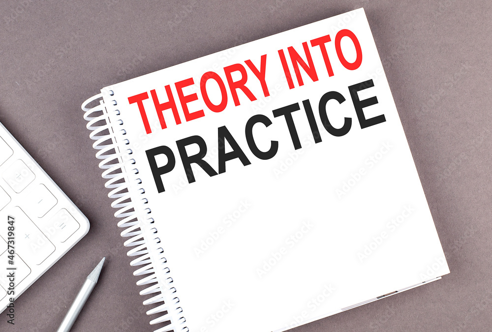 Aufkleber theory into practice text on notebook with calculator and pen,business concept