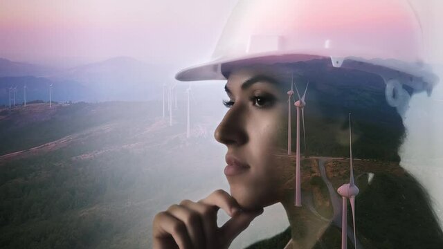 renewable energy,engineer think future plan wind power farm in the background,double exposure of clean energy expert thinking of infrastructure plant installation