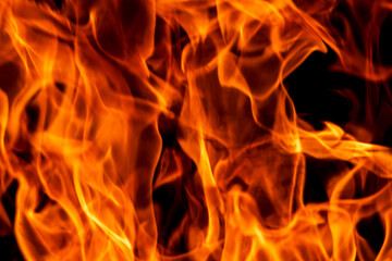 Fototapeta premium Abstract flame, fire flame texture, background. Tongues of fire on a dark background.
