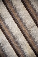 background from old striped fabric, close-up