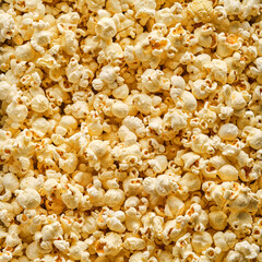 Popcorn background of texture. Flat lay of salted popcorn with cheese. Fastfood background