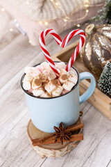 Christmas candy cane heart shape, bokeh background.
