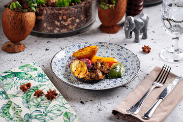 Portion of grilled vegetables garnish on decorated background