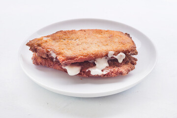tenderloin booklets stuffed with ham and cheese (libritos spanish food)