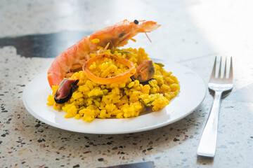 Paella typical spanish food in granite background
