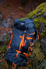 Large tourist backpack on a cliff. The concept of leisure and healthy lifestyle. 