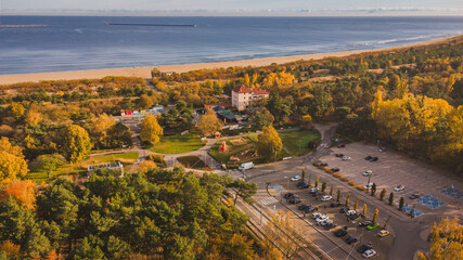 View of the entrance to the beach and the beach itself in Gdańsk Stogi. A fresh view from a drone and an autumn atmosphere. - obrazy, fototapety, plakaty