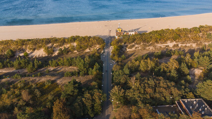 View of the entrance to the beach and the beach itself in Gdańsk Stogi. A fresh view from a drone and an autumn atmosphere. - obrazy, fototapety, plakaty