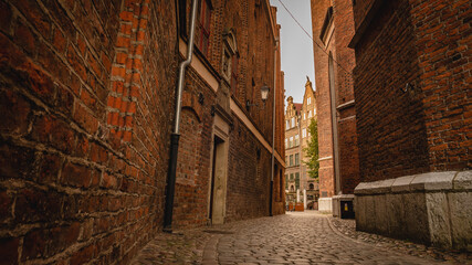 Fototapeta na wymiar View on ul. Parish in Gdańsk. A street with a slightly dark atmosphere straight from crime novels.