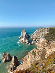 The coast with a rocky shore. Top view of the sea, mountains and beach.