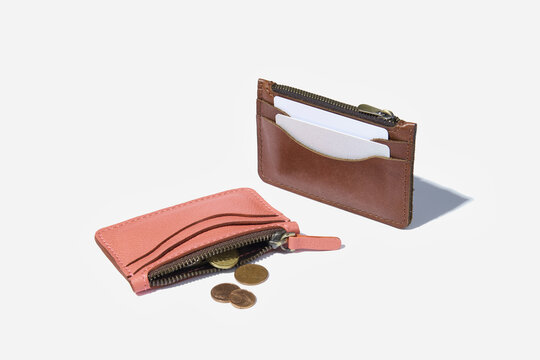 Handmade genuine leather case for credit cards on a white isolated background.