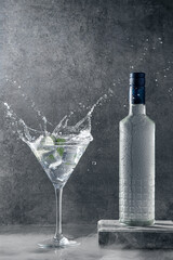 Vodka splash on dark background with copyspace. Vertical format.