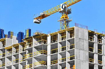 Crane and highrise construction site