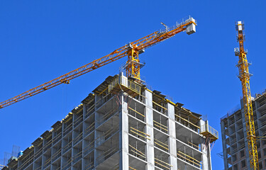Crane and highrise construction site