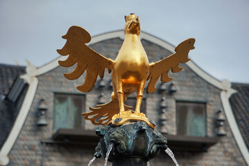 Goslarer Adler, the Golden Medieval Imperial Eagle in Goslar, Harz mountains, Lower Saxony, Germany. Market fountain at Market Square. Historic landmark in the Old Town, UNESCO World Heritage Site.