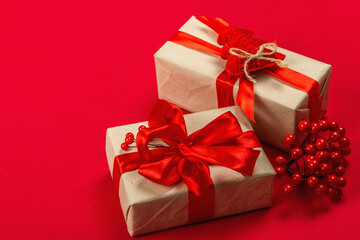 Gift concept in red colors. New Year or Christmas, festive mood