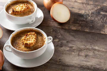 Traditional french onion soup on wooden table