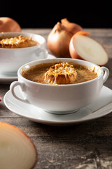 Traditional french onion soup on wooden table