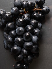 black grapes on black background