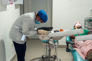 Doctor Preparing Dental Tool For Treatment