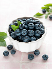 Blueberries on tile background