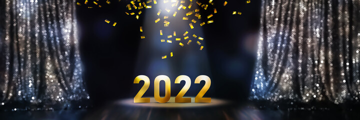 curtain up for golden number 2022, confetti rain and spot light on stage at night, festive concept...