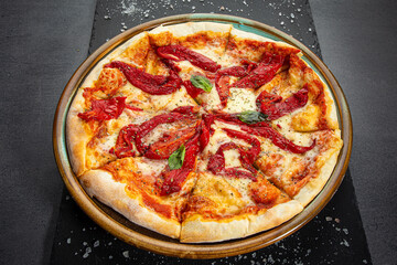 Pizza with smoked bell pepper, tomatoes and herbs