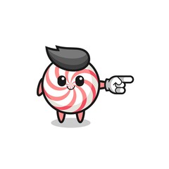swirl lollipop mascot with pointing right gesture