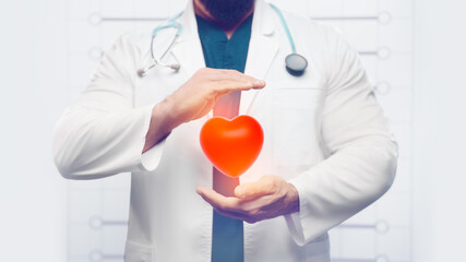 The doctor holds heart in his hands. Health care concept
