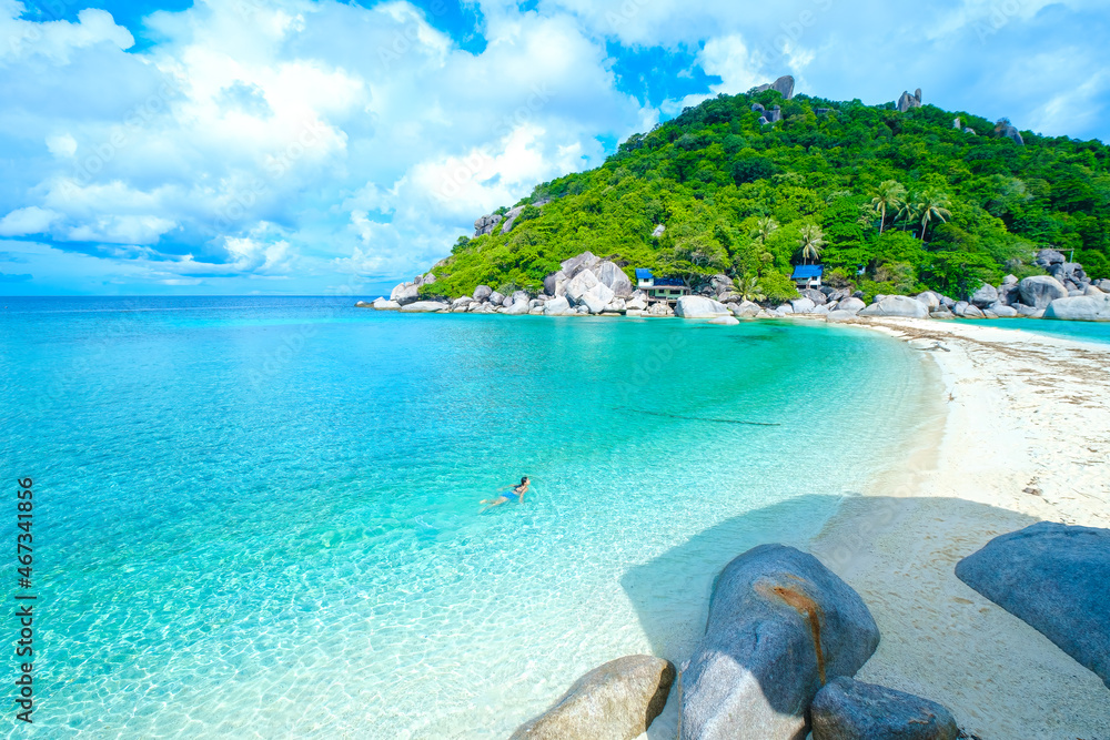 Wall mural the woman on the beach, clear water sea with blue sky on the holiday, swim on the turquoise water be