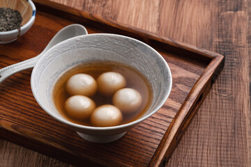 Sesame big tangyuan with syrup soup.